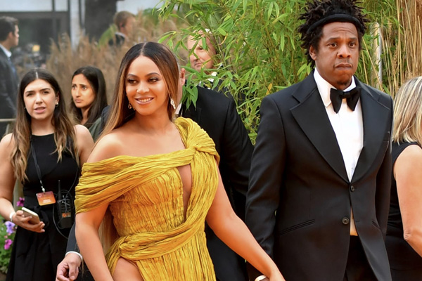  Beyoncé and Jay-Z walking the red carpet. Gareth Cattermole/Getty Images for Disney